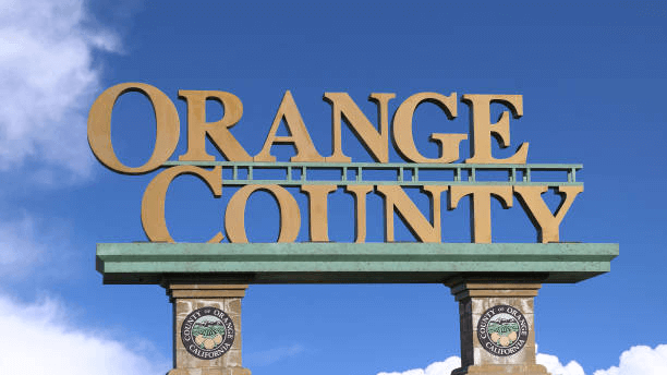 Orange County welcome sign on top of two stone pillars.