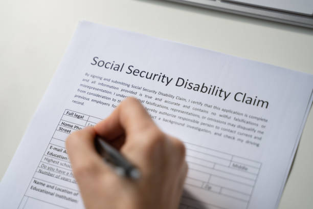 A Social Security Disability claim form being filled out.